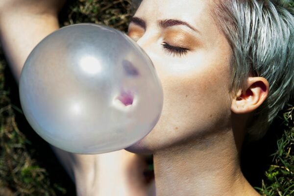 a man kissing a bubble
